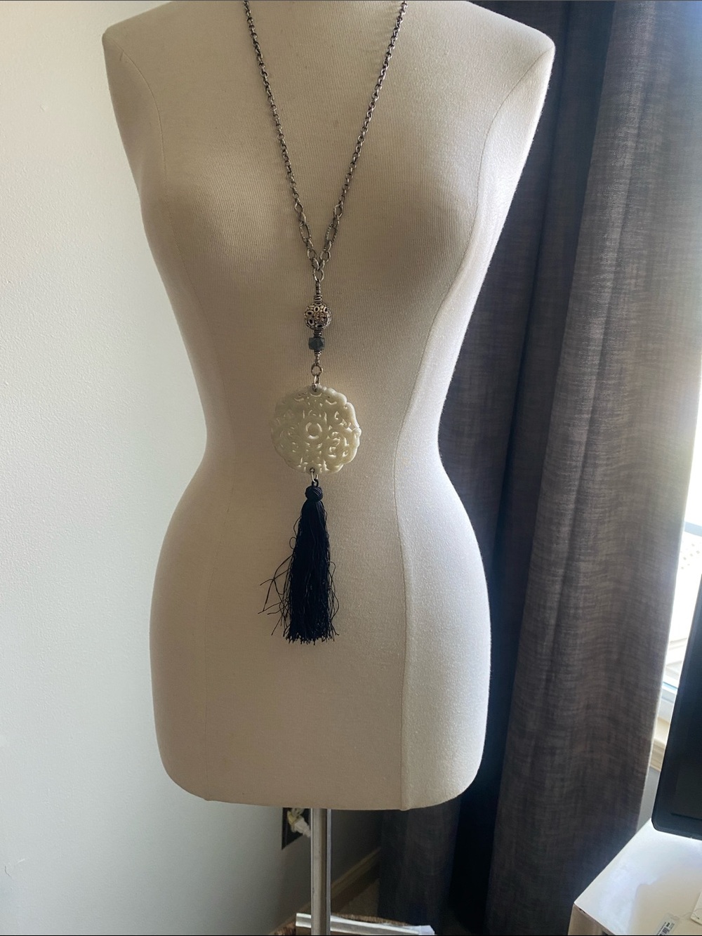 Long Sterling Silver Necklace WithWhite Carved Jade and Black Tassel.